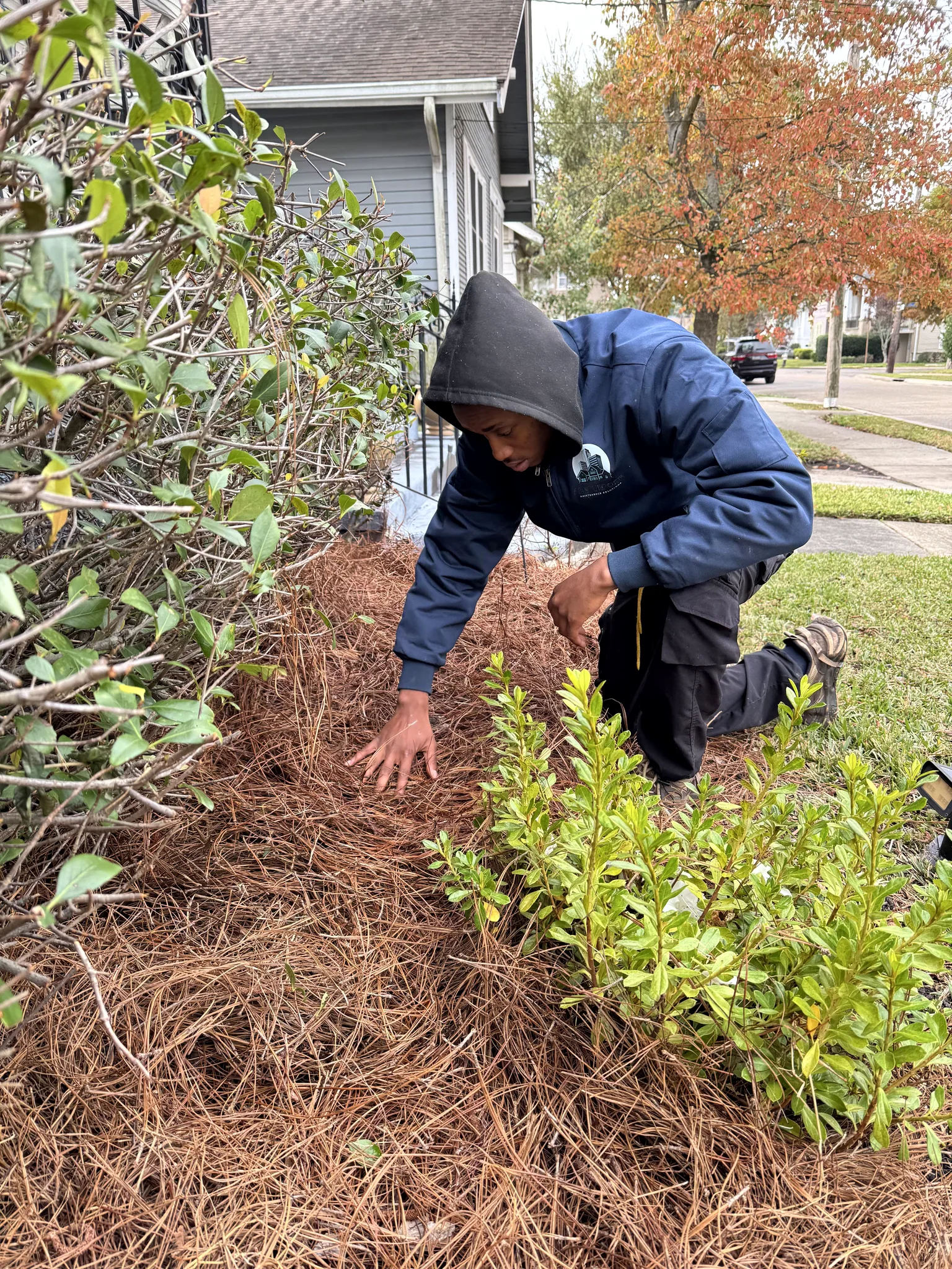 All Purpose Maintenance Solutions technician working in a garden